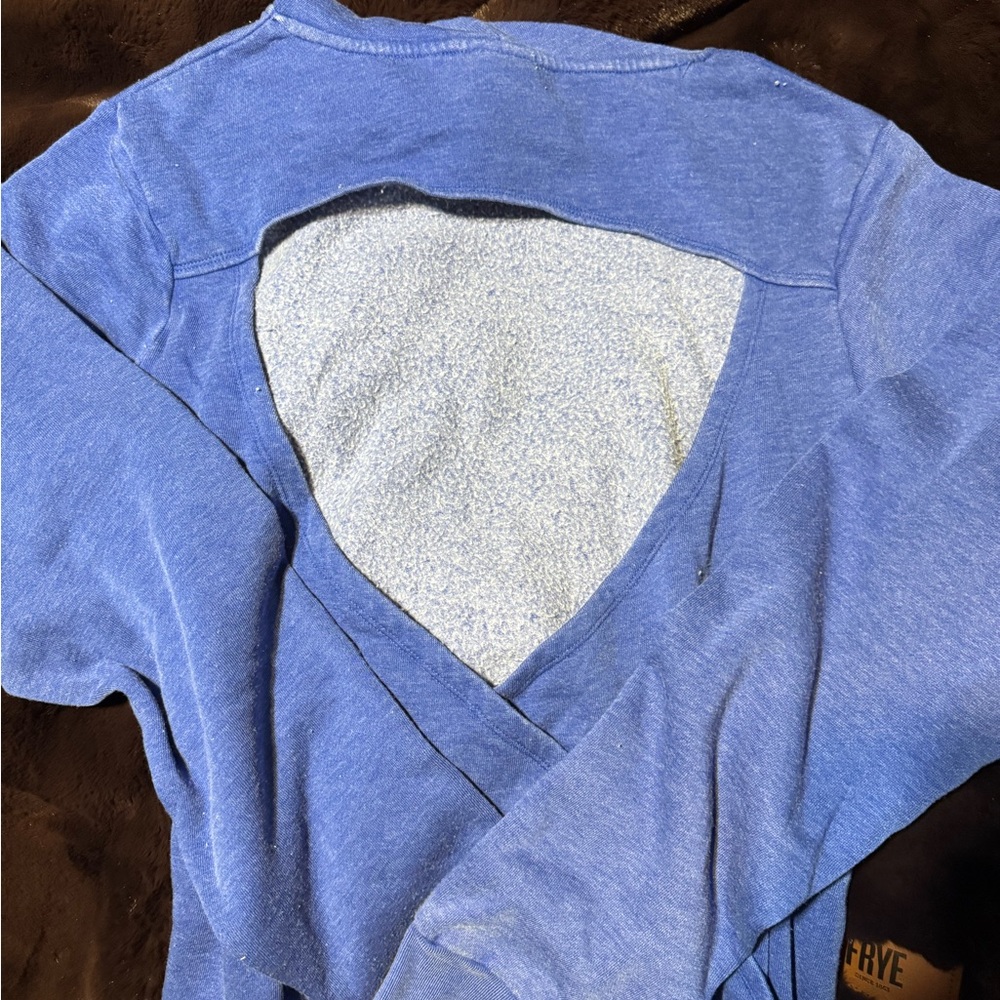 Distressed sweatshirt with open back to wear a strappy bra or tank